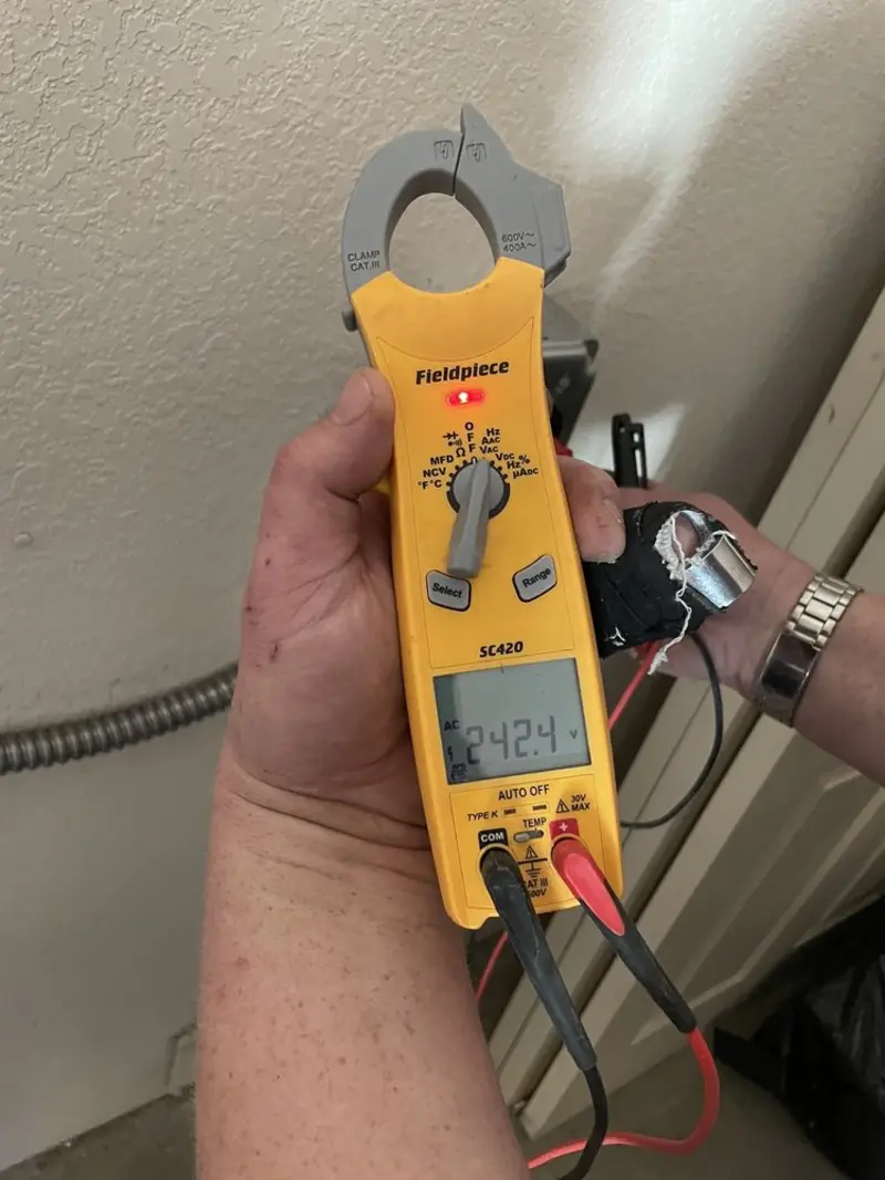 Voltage testing with clamp meter during Outlet Installation in Beeville